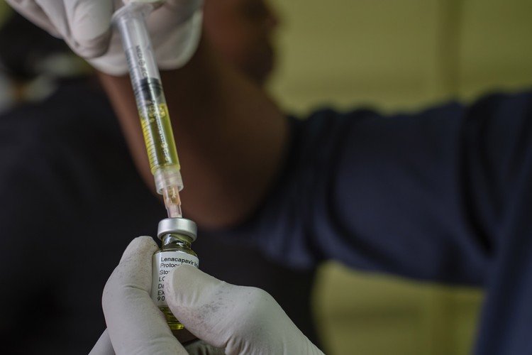 A South African nurse preparing preventative medicine