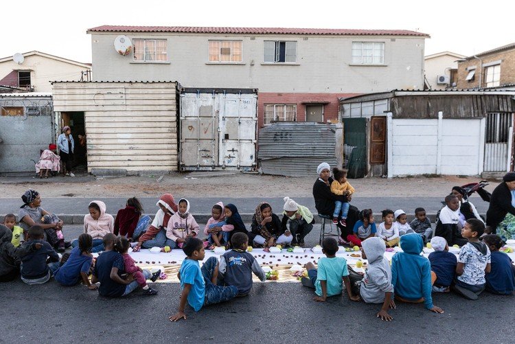 A neighbourhood boeka gathering in Manenberg
