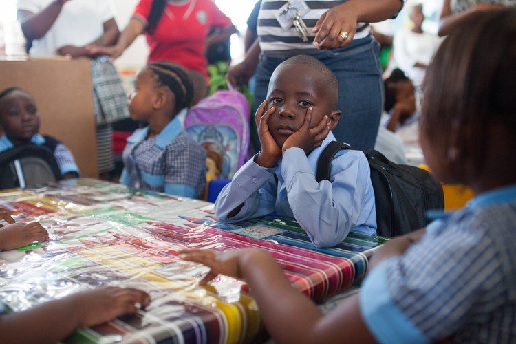 Children settling into their first-day classroom routine